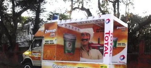 A street performance staged for the TRACTAGRI XPL campaign, drawing a crowd at a rural market.